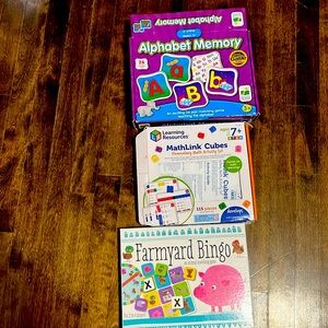 Learning resources MathLink Cubes, alphabet memory game, and farmyard bingo.